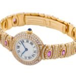 Closeup shot of a luxurious gold wristwatch with amethysts and diamonds set in it